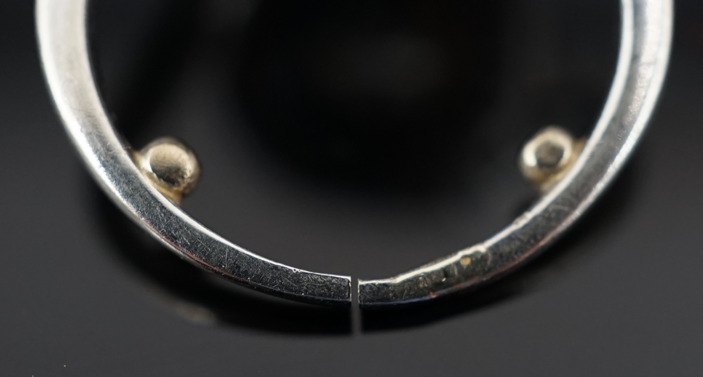 A mid 20th century platinum and diamond cluster set ring, of spiralling design
